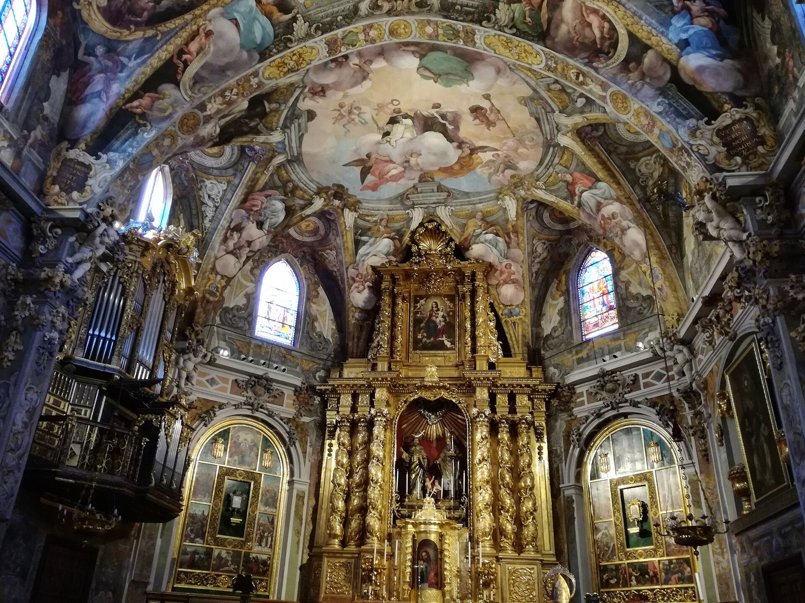 Painted Baroque ceiling and altar inside San Nicolás church